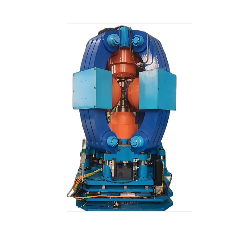 Front view of a six-sided top press with hydraulic manifolds and control cabinet